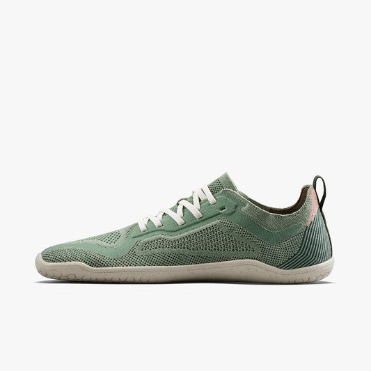 Lightweight green knit sneaker with white laces and beige sole, side profile on white background