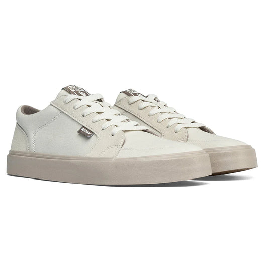 Minimalist off-white suede low-top sneakers with beige rubber soles and white laces