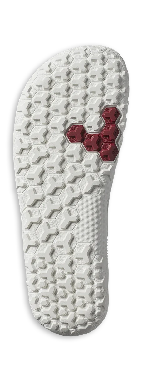 white rubber shoe outsole with hexagonal tread pattern and red hexagonal detail