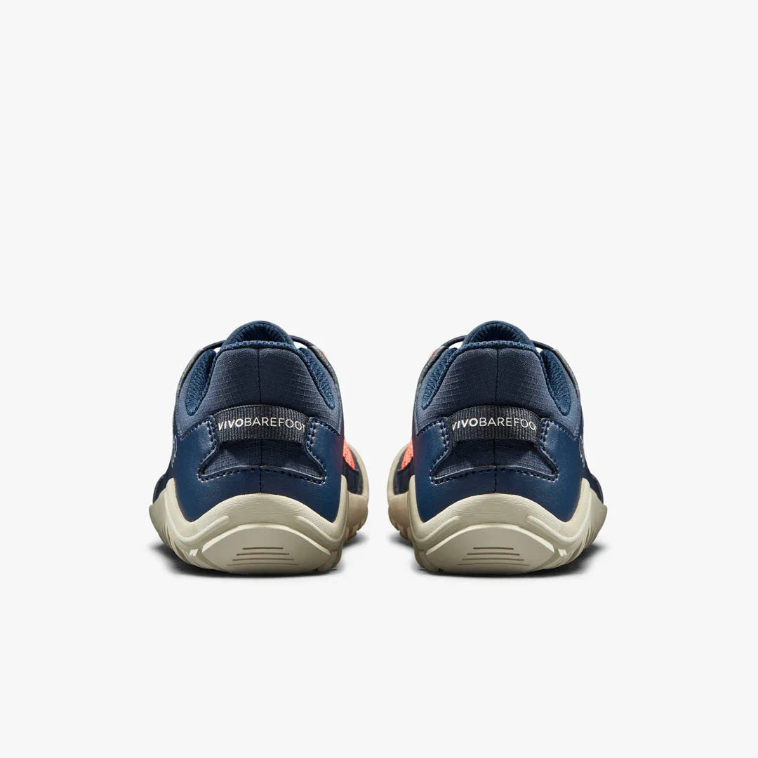 Back view of navy blue Vivobarefoot casual shoes with beige soles on white background