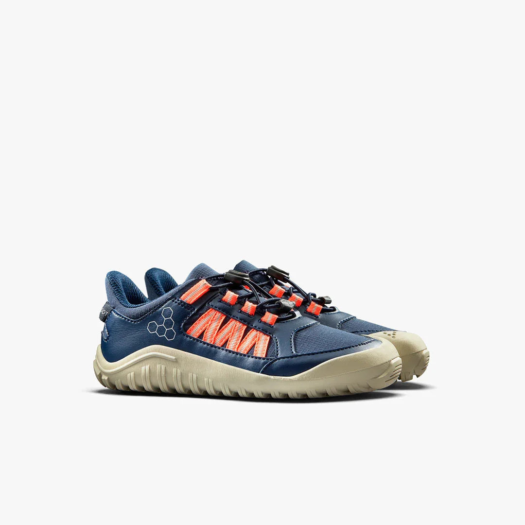 Navy blue and orange athletic shoes with beige soles on white background