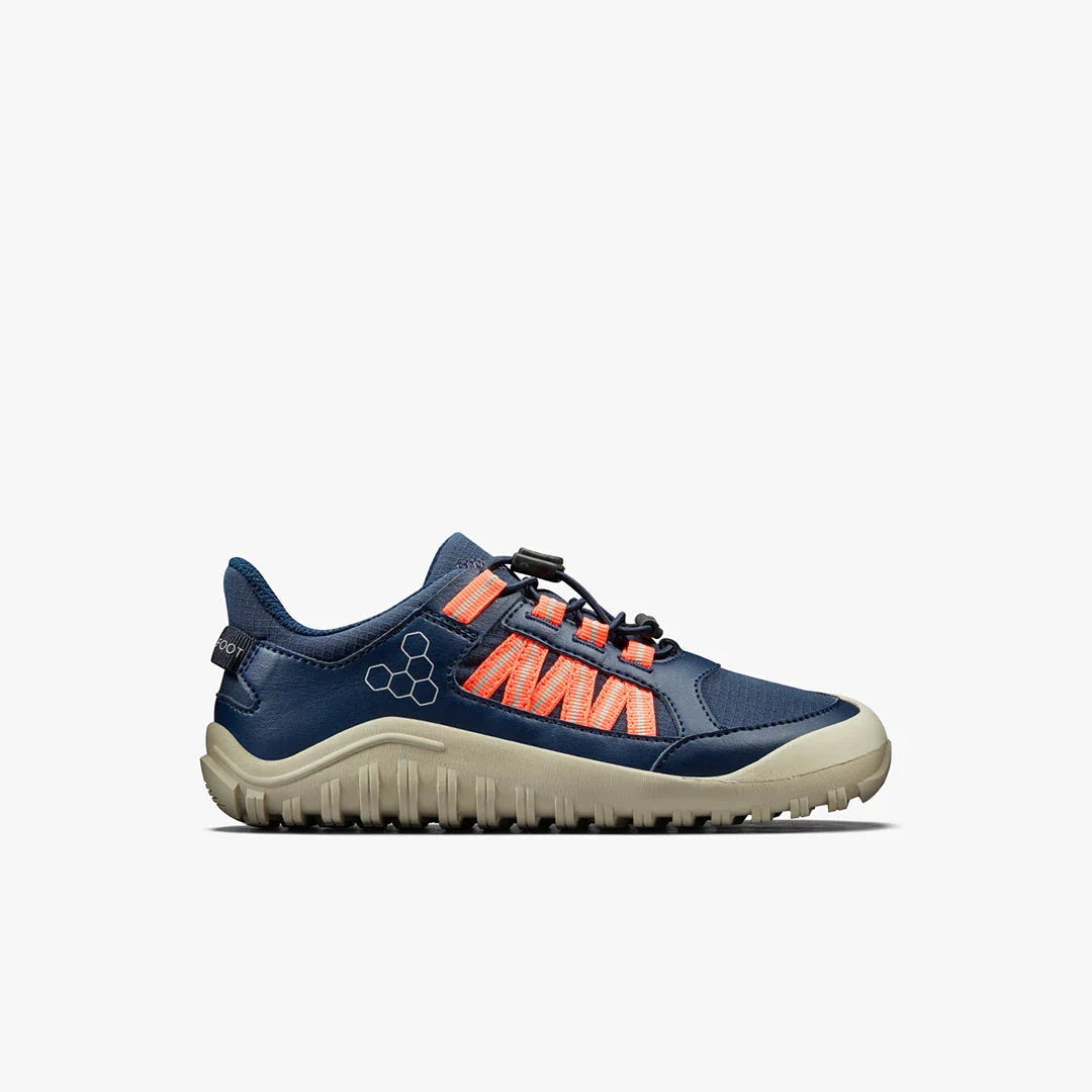 Navy blue and beige trail running shoe with orange laces and rugged sole on white background