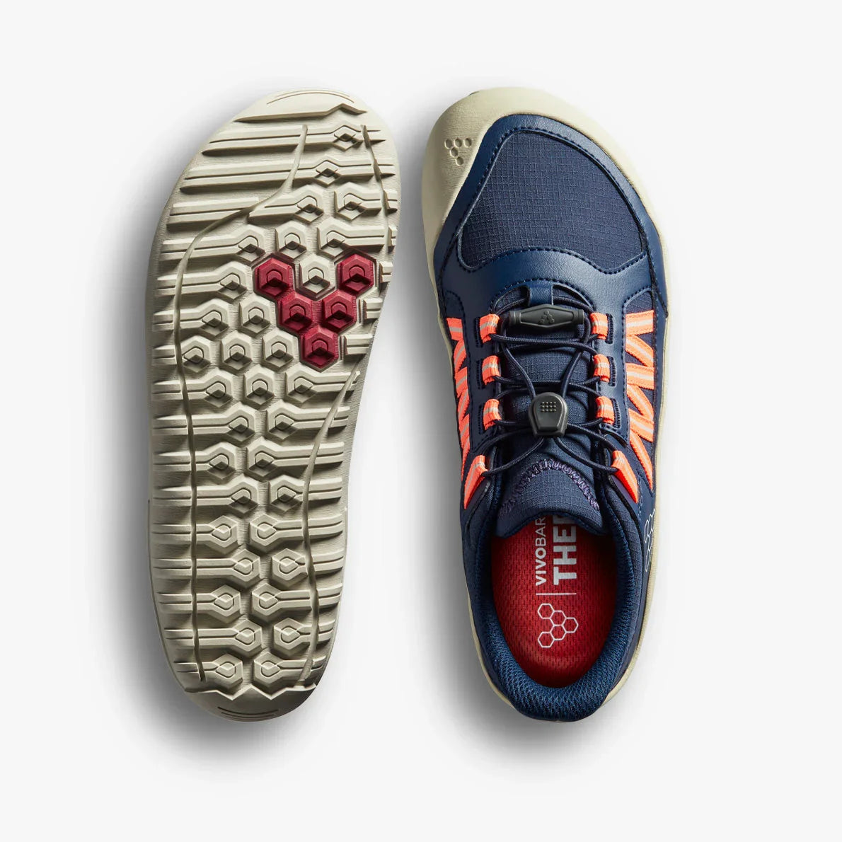 Navy blue and neon orange athletic shoe with textured sole featuring hexagonal grip pattern