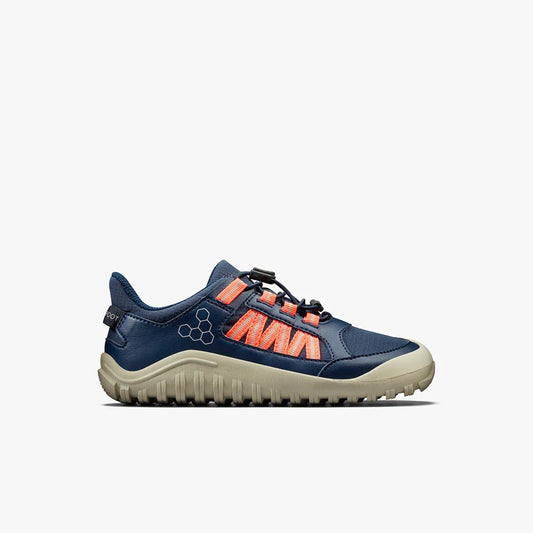 Side view of navy blue and coral hiking shoe with beige rugged sole on white background