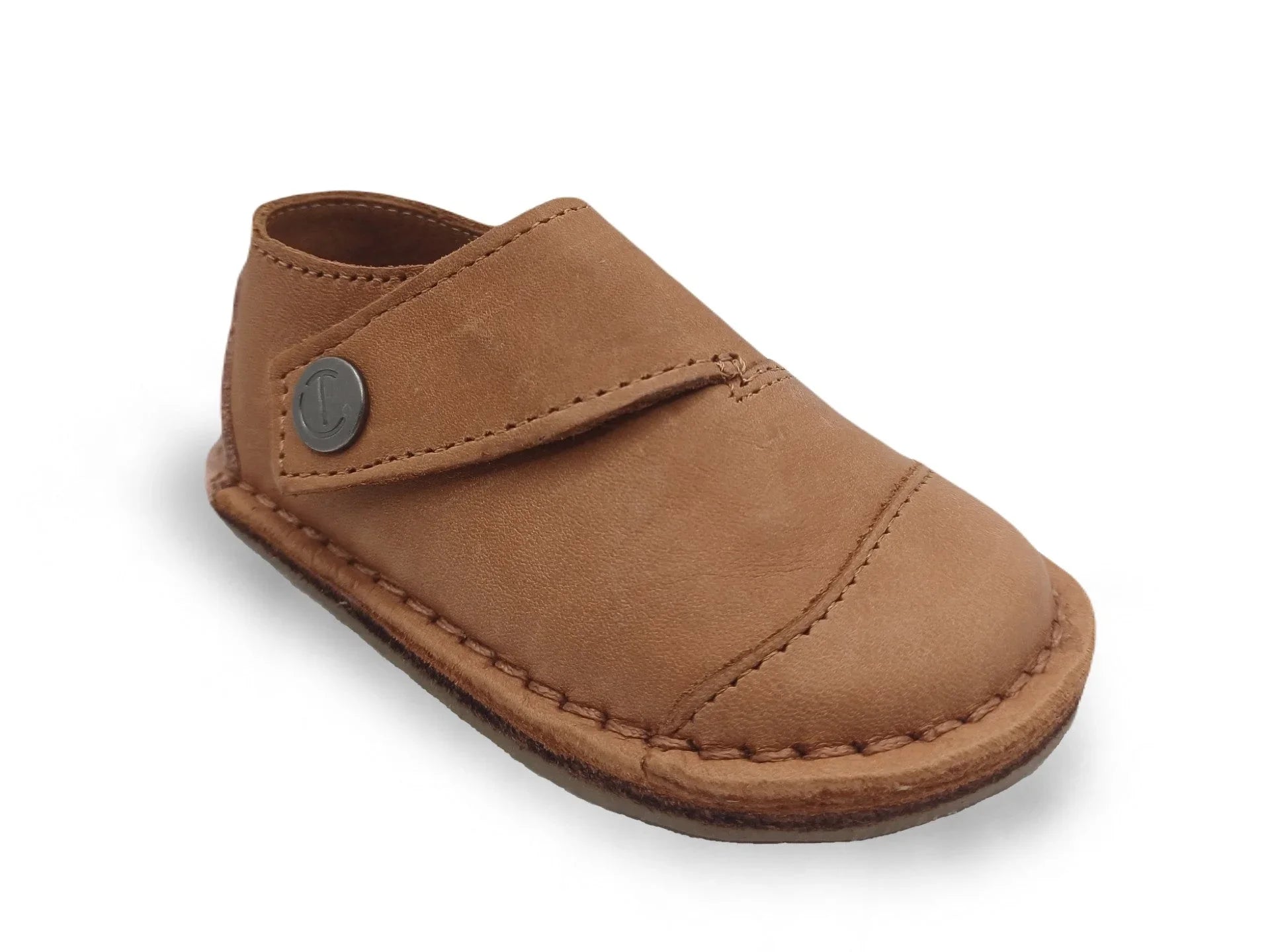 Brown leather baby moccasin shoe with stitched sole and decorative button detail
