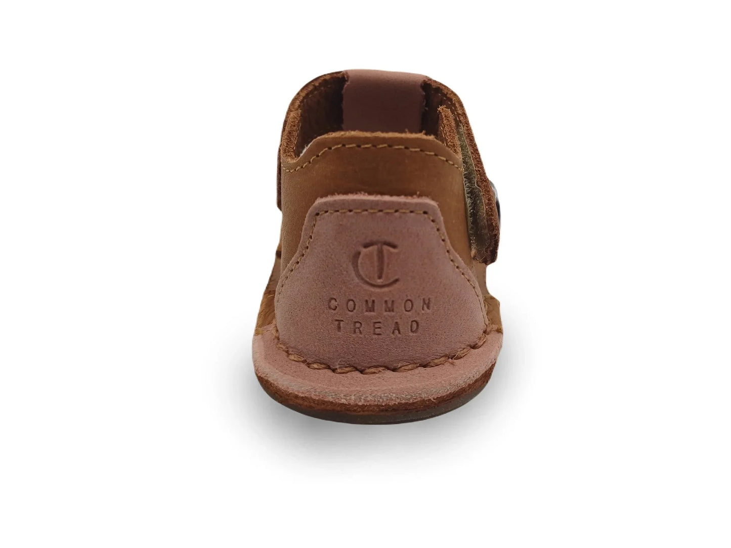 Brown leather baby shoe with stitched sole and embossed Common Tread logo on heel
