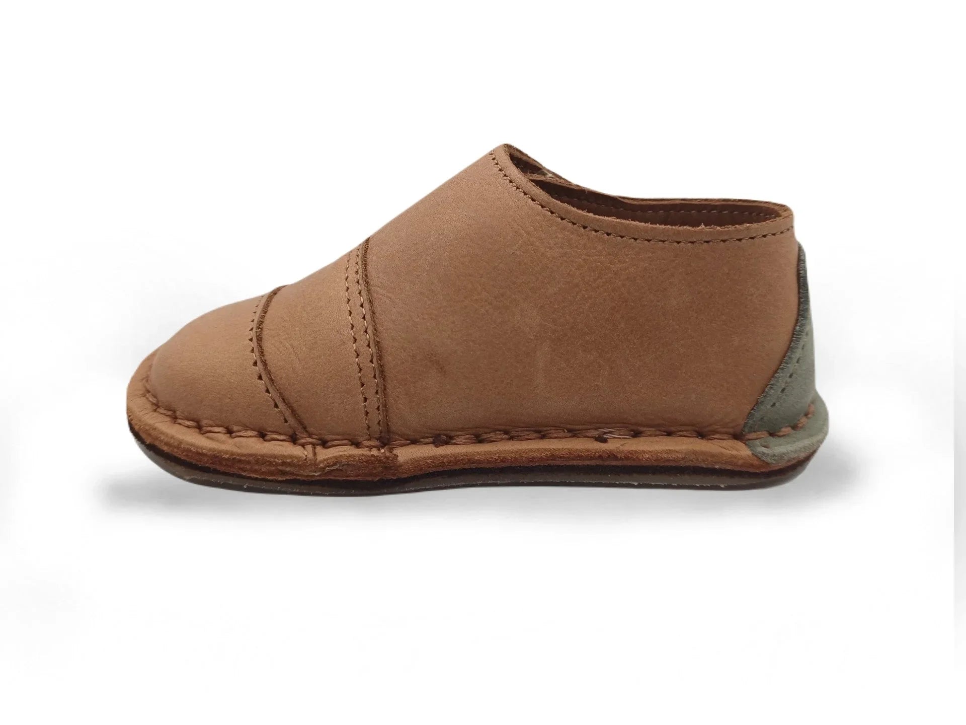 brown leather handmade slipper with soft sole and stitched detailing on white background