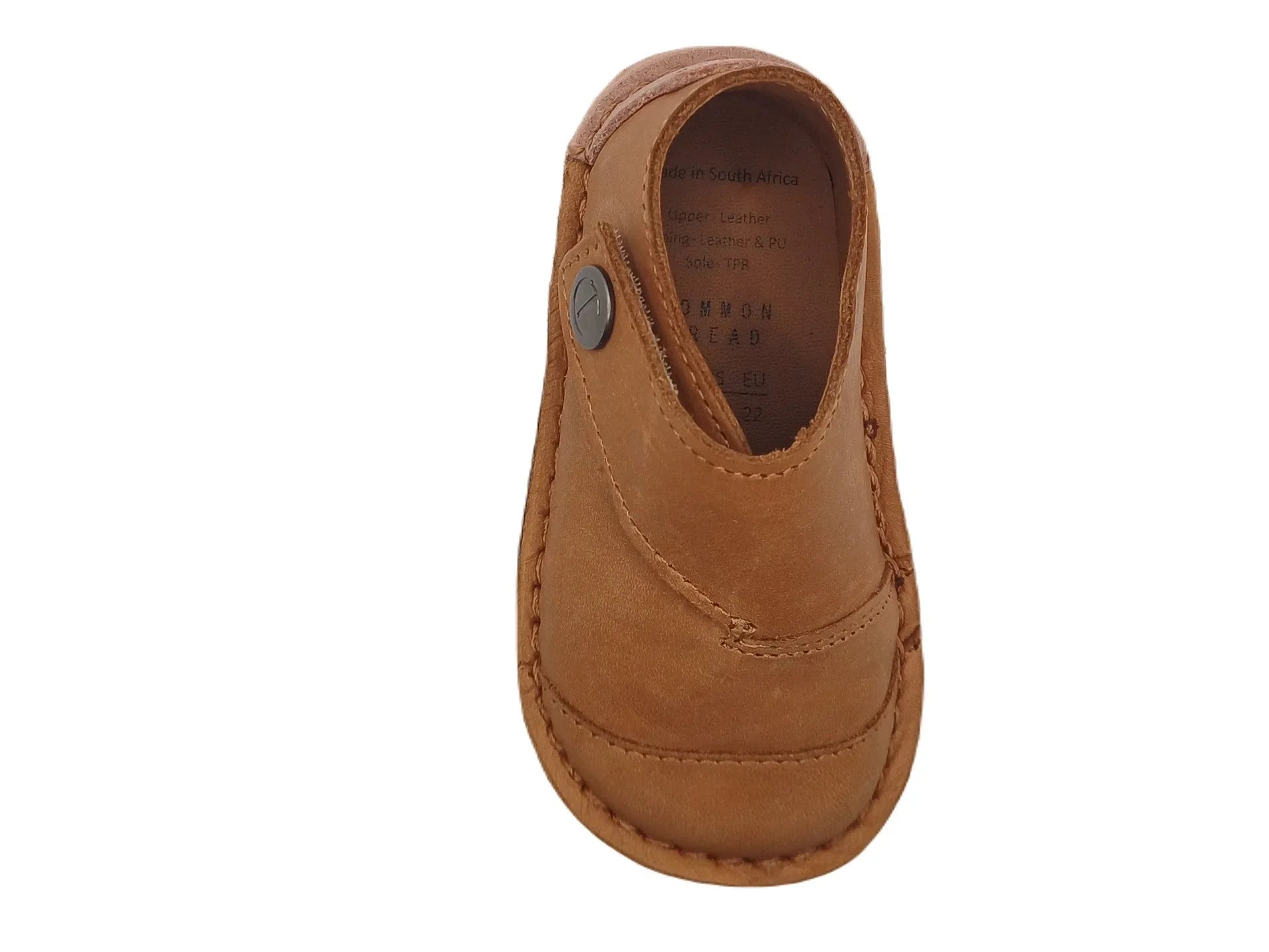 Brown leather baby shoe with button detail and stitched sole on white background