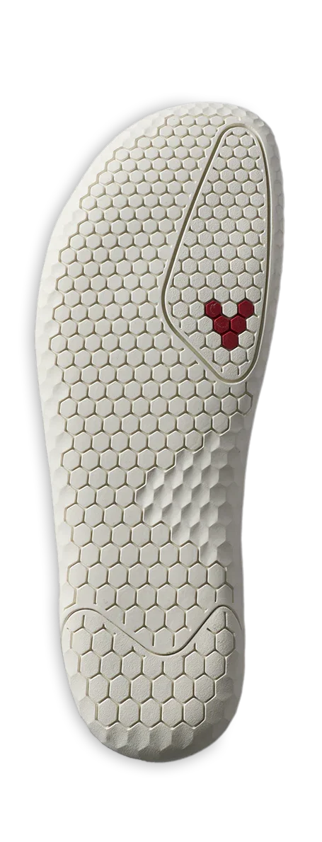 White shoe outsole with hexagonal tread pattern and three red hexagons near the top