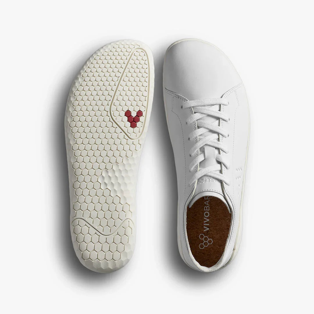 Top and bottom view of white Vivobarefoot minimalist sneakers with hexagonal sole pattern