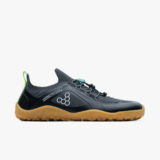 Side view of black Vivobarefoot minimalist trail running shoe with gum sole and mesh upper