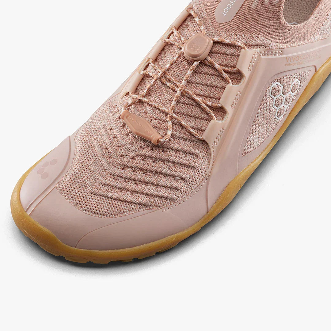 Close-up of pink Vivobarefoot knitted sneaker with adjustable lacing and gum sole