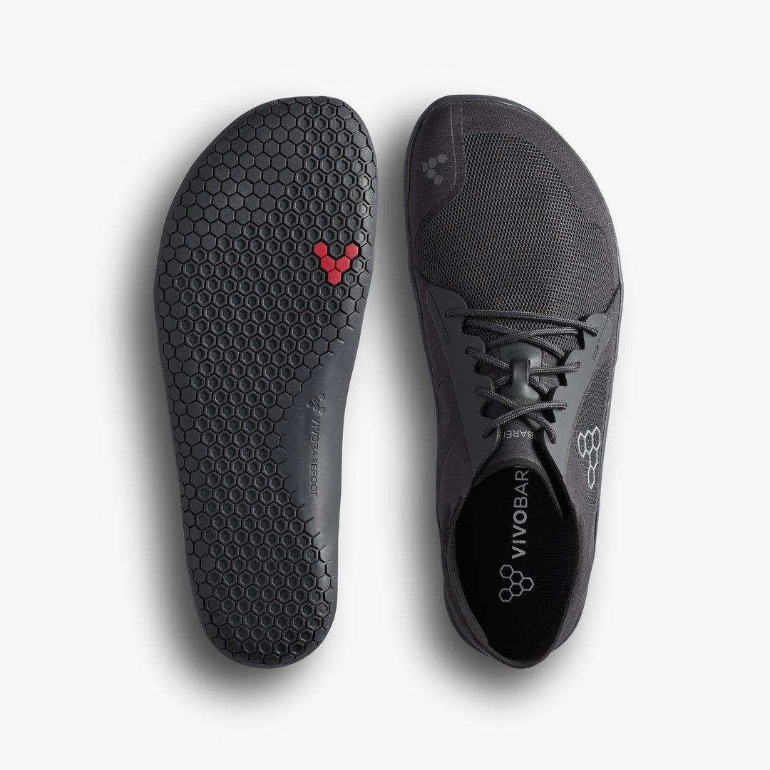 Gray athletic shoe with brand logo on a white background