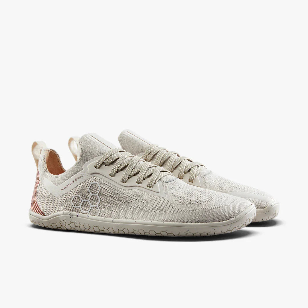 Light beige minimalist knit running shoes with honeycomb pattern sole and laces