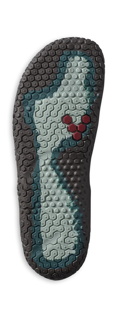 Close-up of a multi-textured shoe outsole with black, gray, and red hexagonal patterns for grip and traction