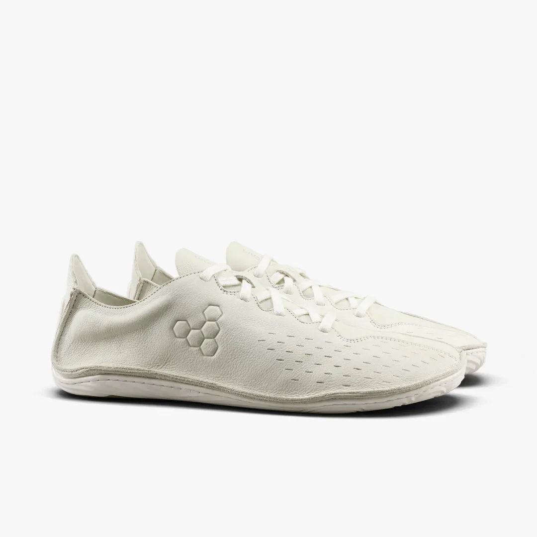Pair of minimalist off-white leather barefoot shoes with hexagonal logo and lace-up design