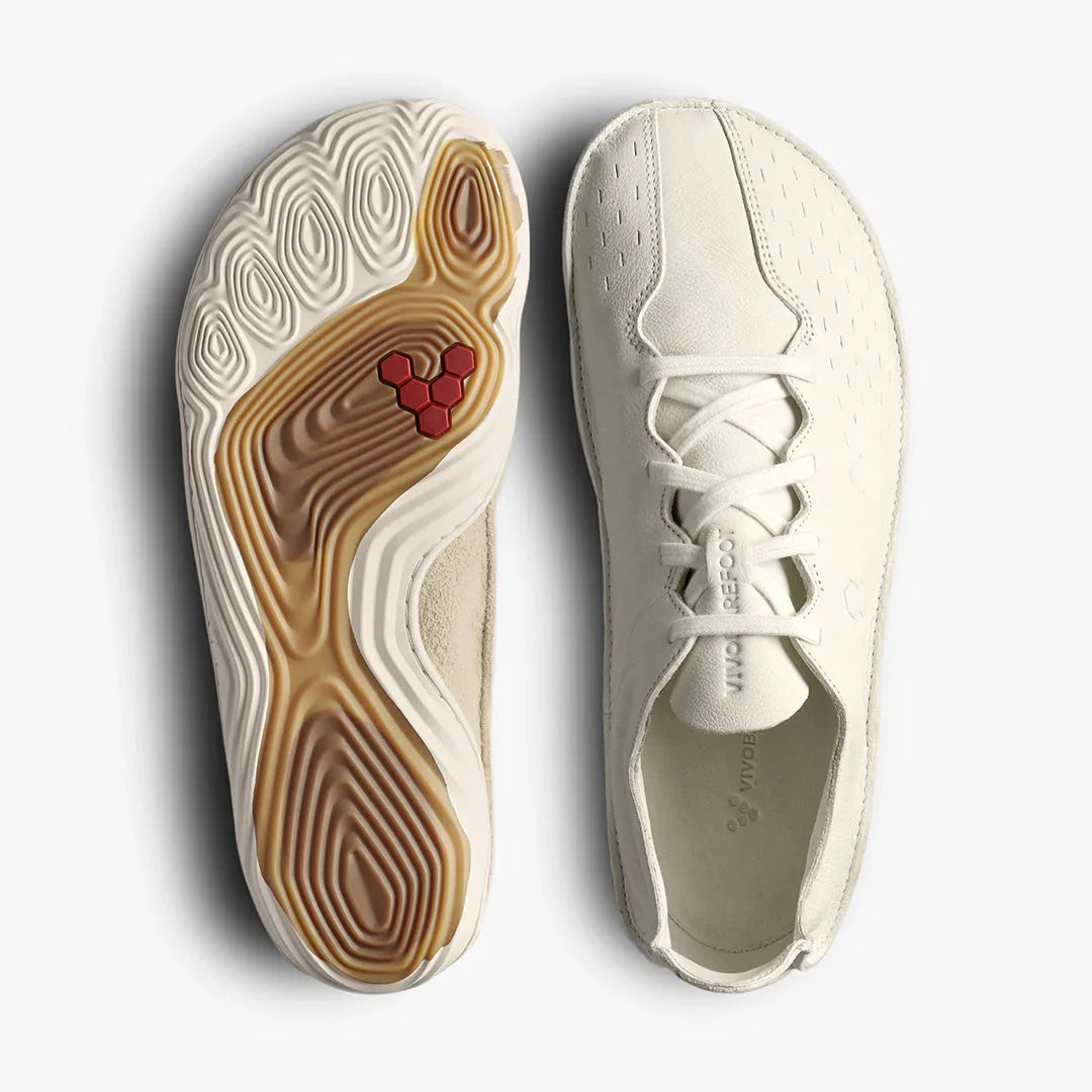 White minimalist sneaker with textured sole and laces, shown from top and bottom views