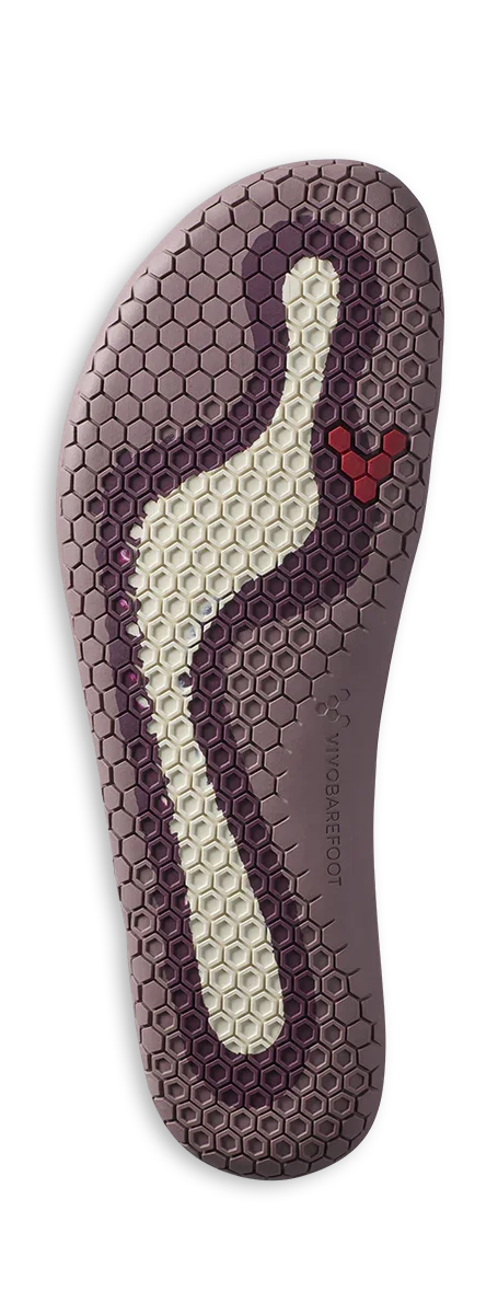 Grip outsole of Vivobarefoot shoe with hexagonal tread pattern and arch support design