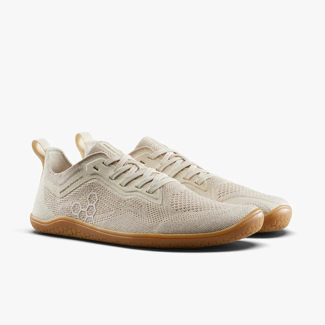 Light beige knit sneakers with gum rubber soles and side hexagon logo detail