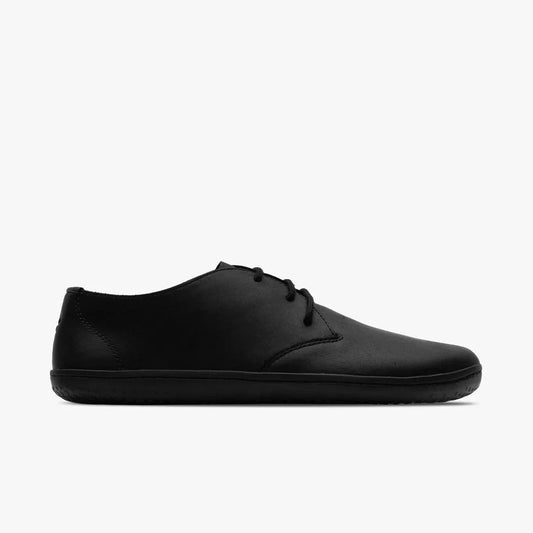 Minimalist black leather lace-up shoe side view with sleek design and rubber sole