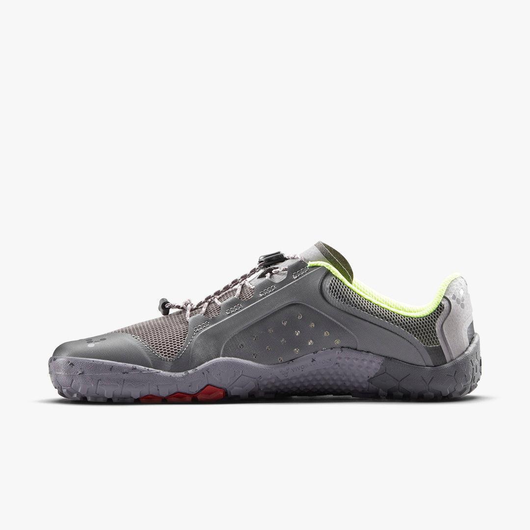 Grey minimalist running shoe with neon yellow interior lining and textured sole