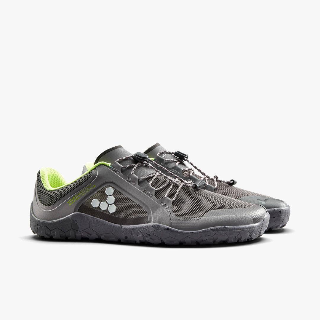 Pair of gray lightweight barefoot running shoes with neon green inner lining and hexagonal logo