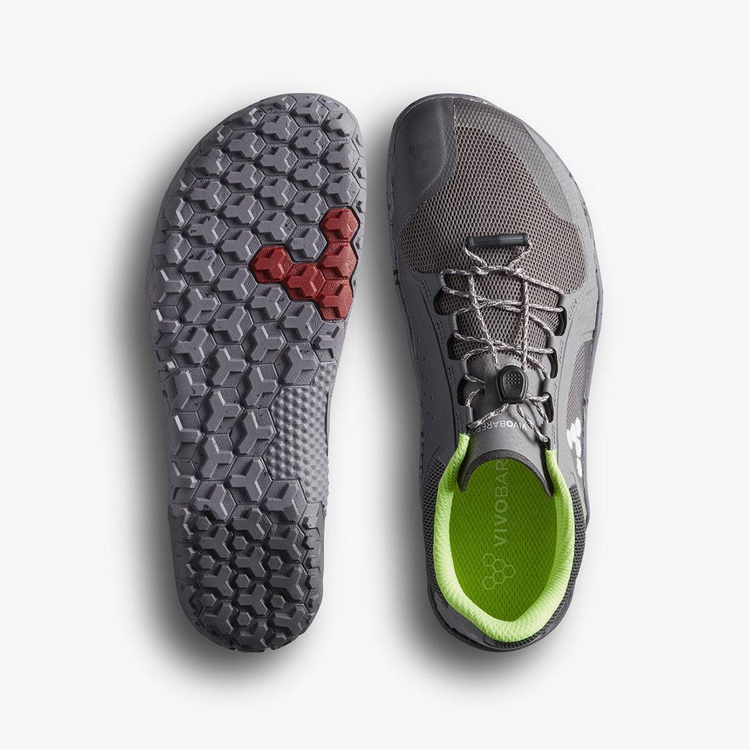 Grey Vibram FiveFingers barefoot running shoe with hexagonal tread sole and green inner lining
