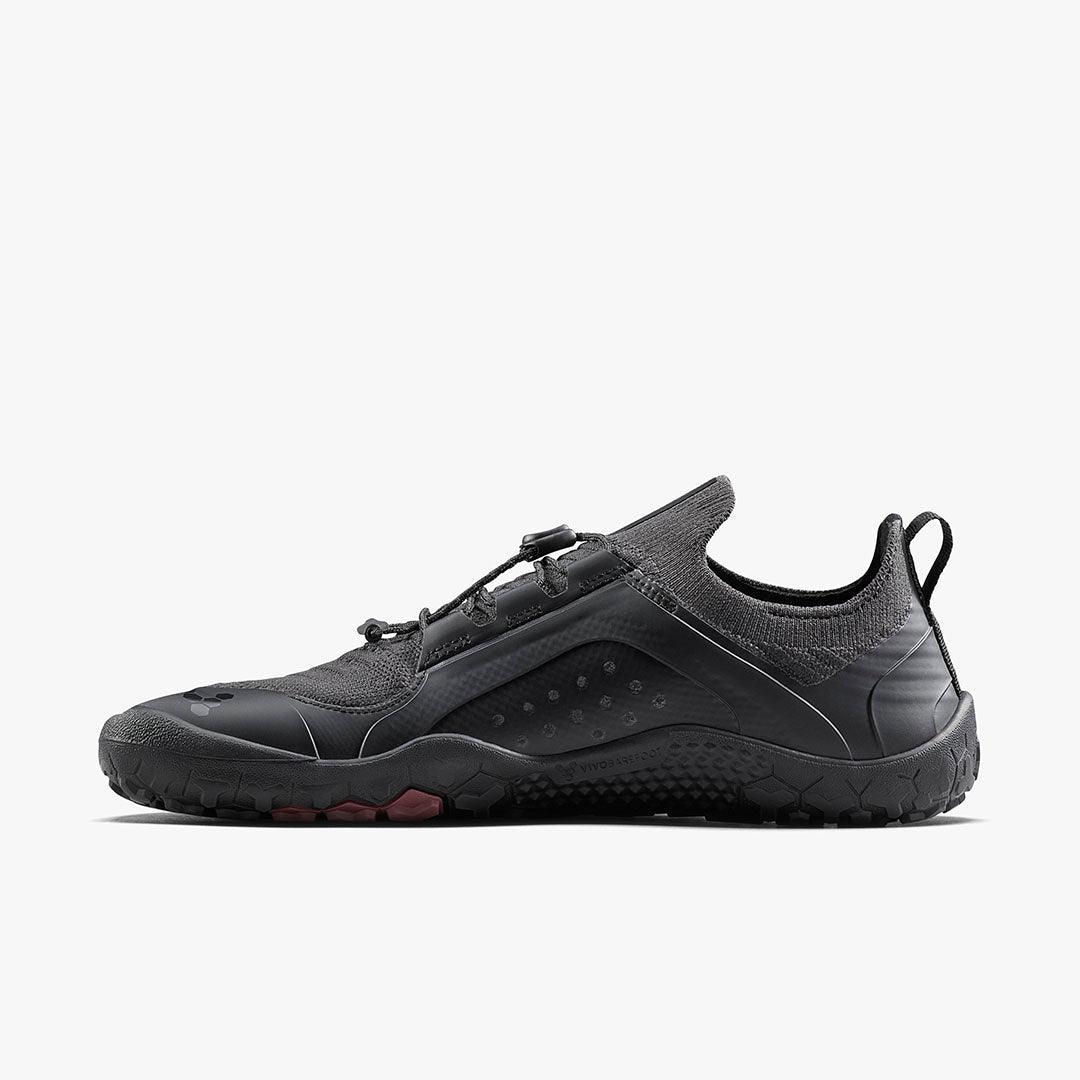 Black barefoot shoe with minimalist design, flexible sole, and eco-friendly materials