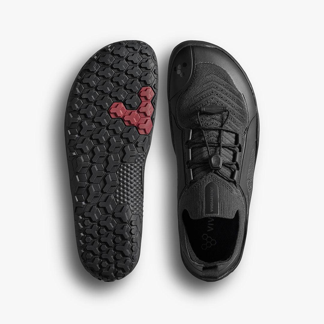 Black barefoot shoe with hexagonal tread sole, eco-friendly design, top and sole view