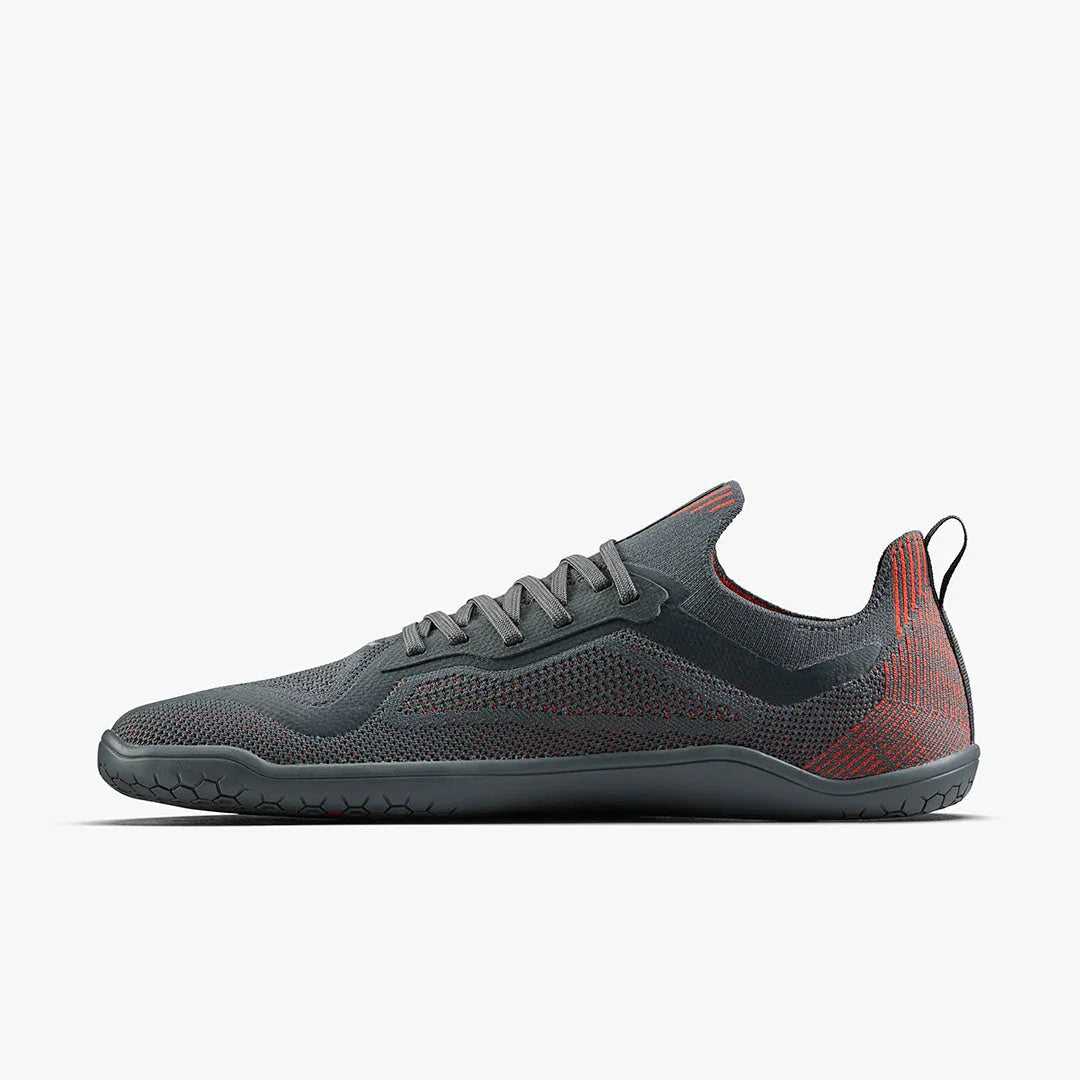 Sleek gray and red minimalist barefoot running shoe with hex-grip sole and knit upper