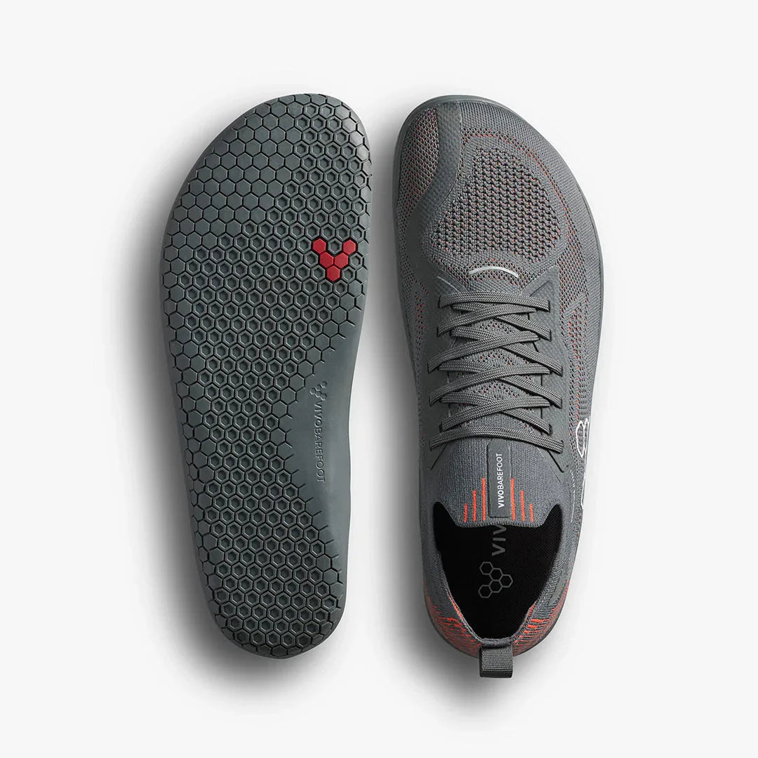 Gray Vivobarefoot minimalist sneaker with honeycomb sole pattern and breathable mesh upper
