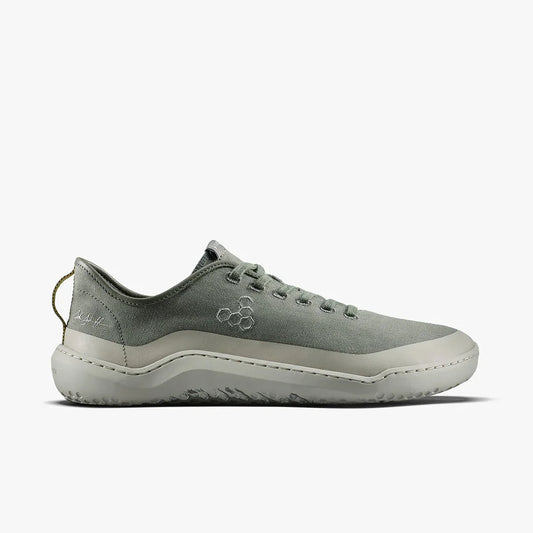 Side view of minimalist gray canvas sneaker with white sole and hexagon logo