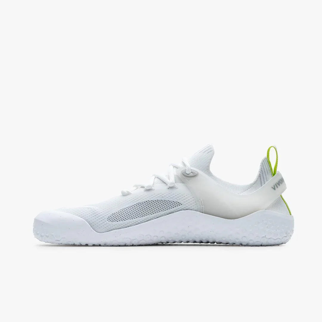 White lightweight breathable athletic shoe with mesh upper and green pull tab