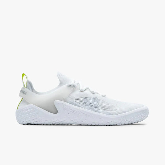 white minimalist running shoe with mesh upper, textured sole, and green pull tab detail