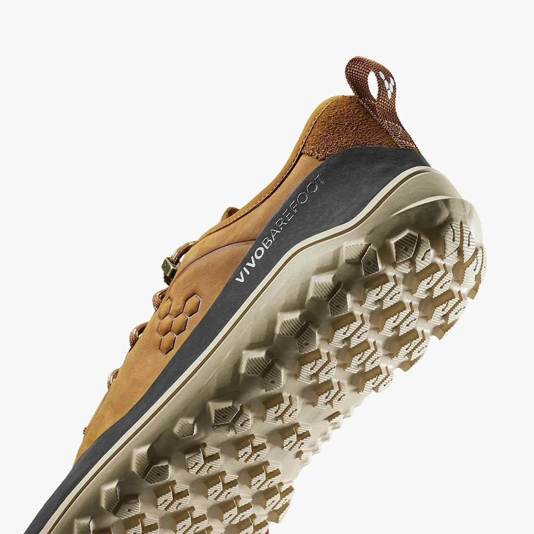 Close-up of VivoBarefoot outdoor shoe in brown leather with textured off-white sole and heel pull tab
