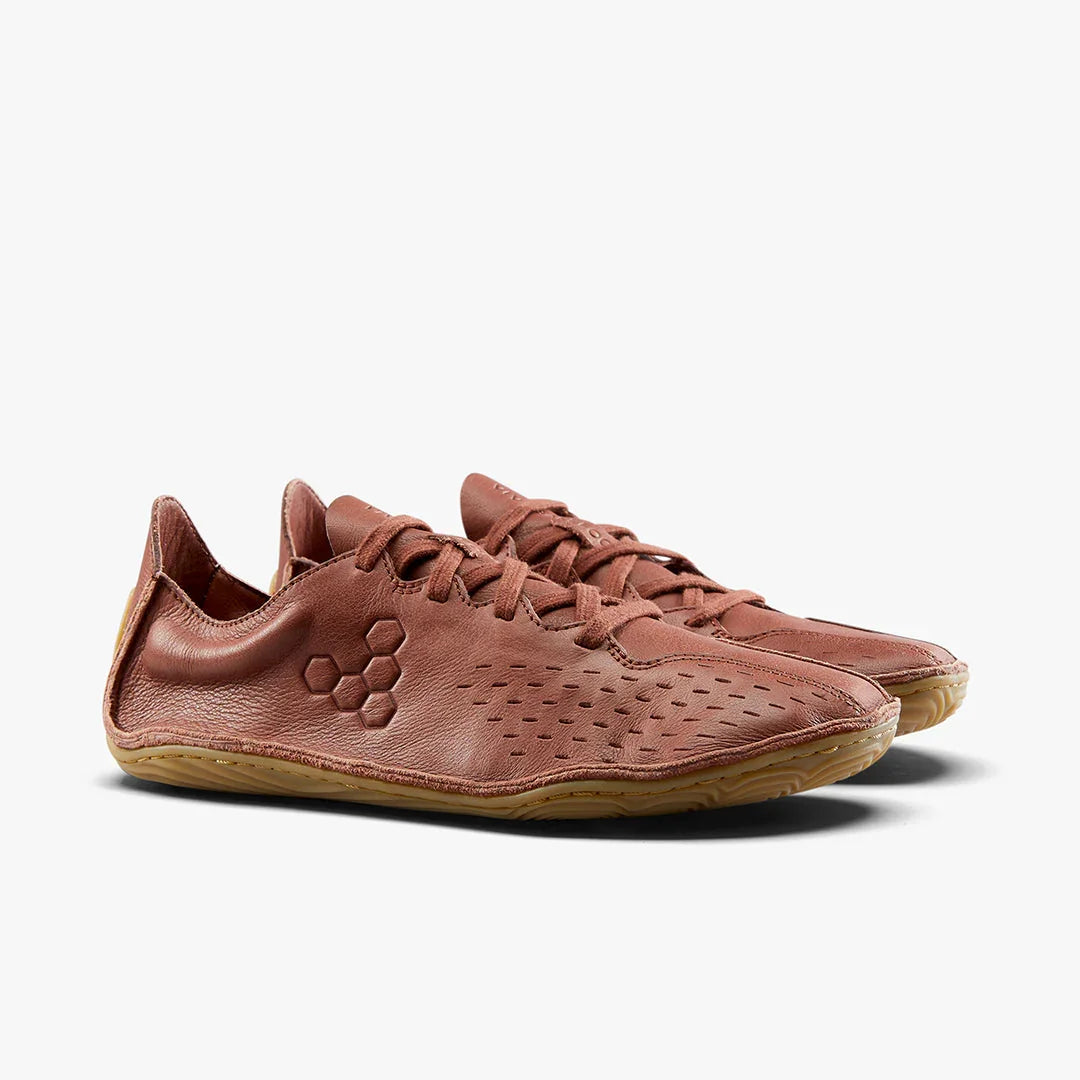 Minimalist brown leather lace-up shoes with honeycomb detail and perforated design