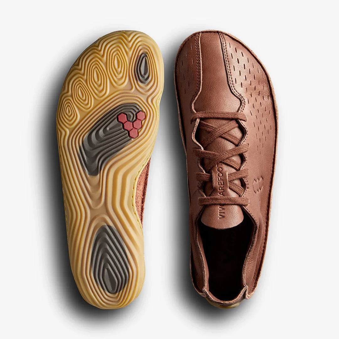 Brown Vivobarefoot minimalist leather shoes with textured rubber sole showing foot-shaped grooves