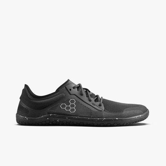 Side view of a black minimalist running shoe with hexagonal logo and textured sole