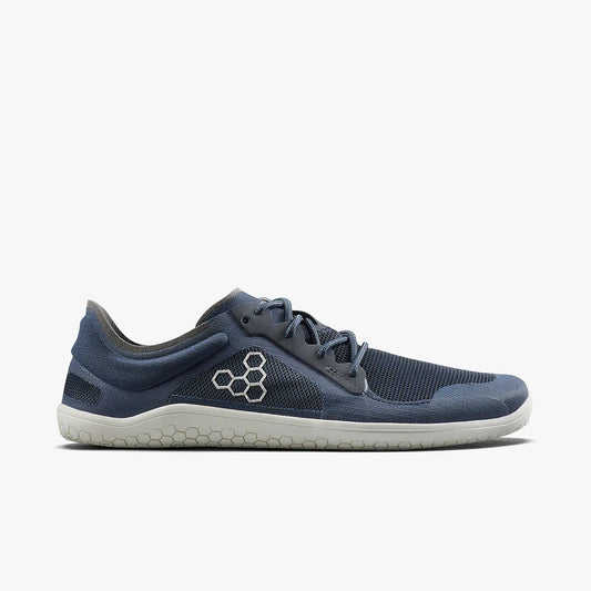 Minimalist navy blue athletic shoe with mesh fabric and honeycomb logo on white sole