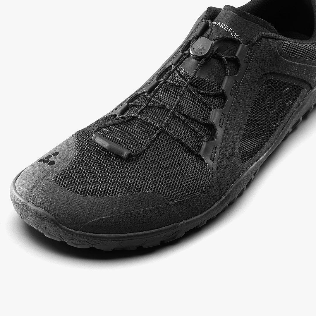 Closeup of black sustainable barefoot shoe with mesh upper and minimalist design