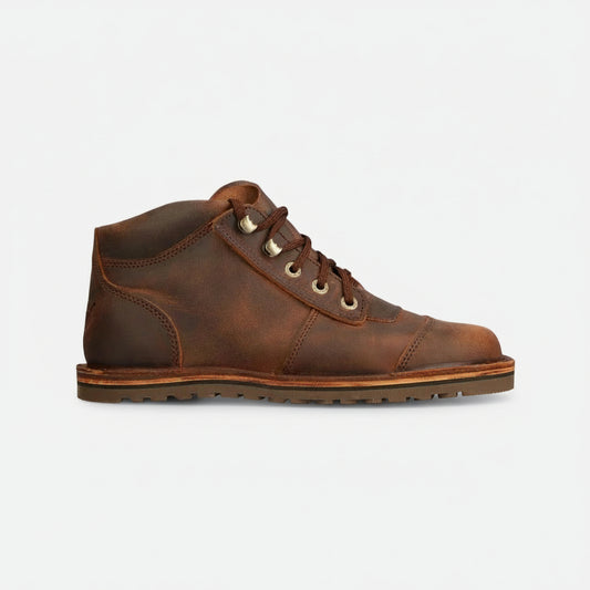 Brown leather boot on a white background