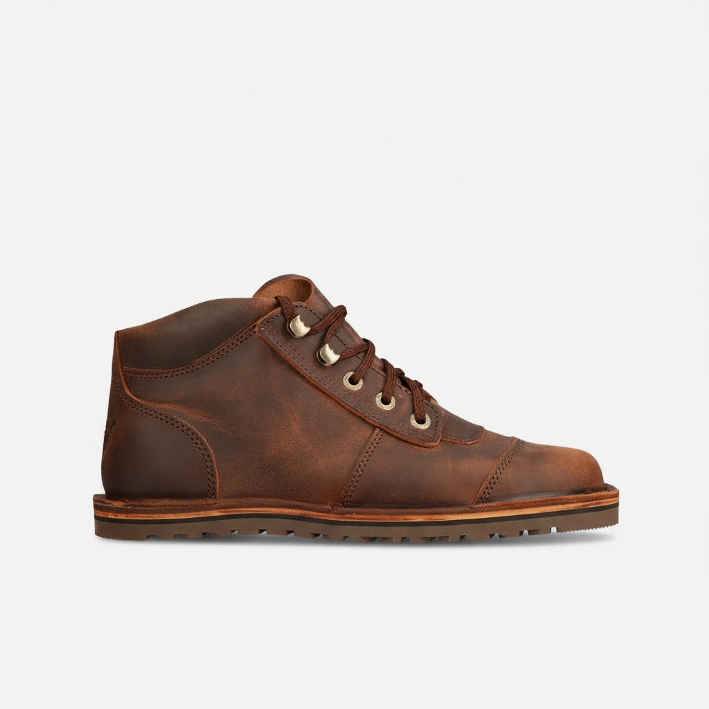 Brown leather boot on a white background