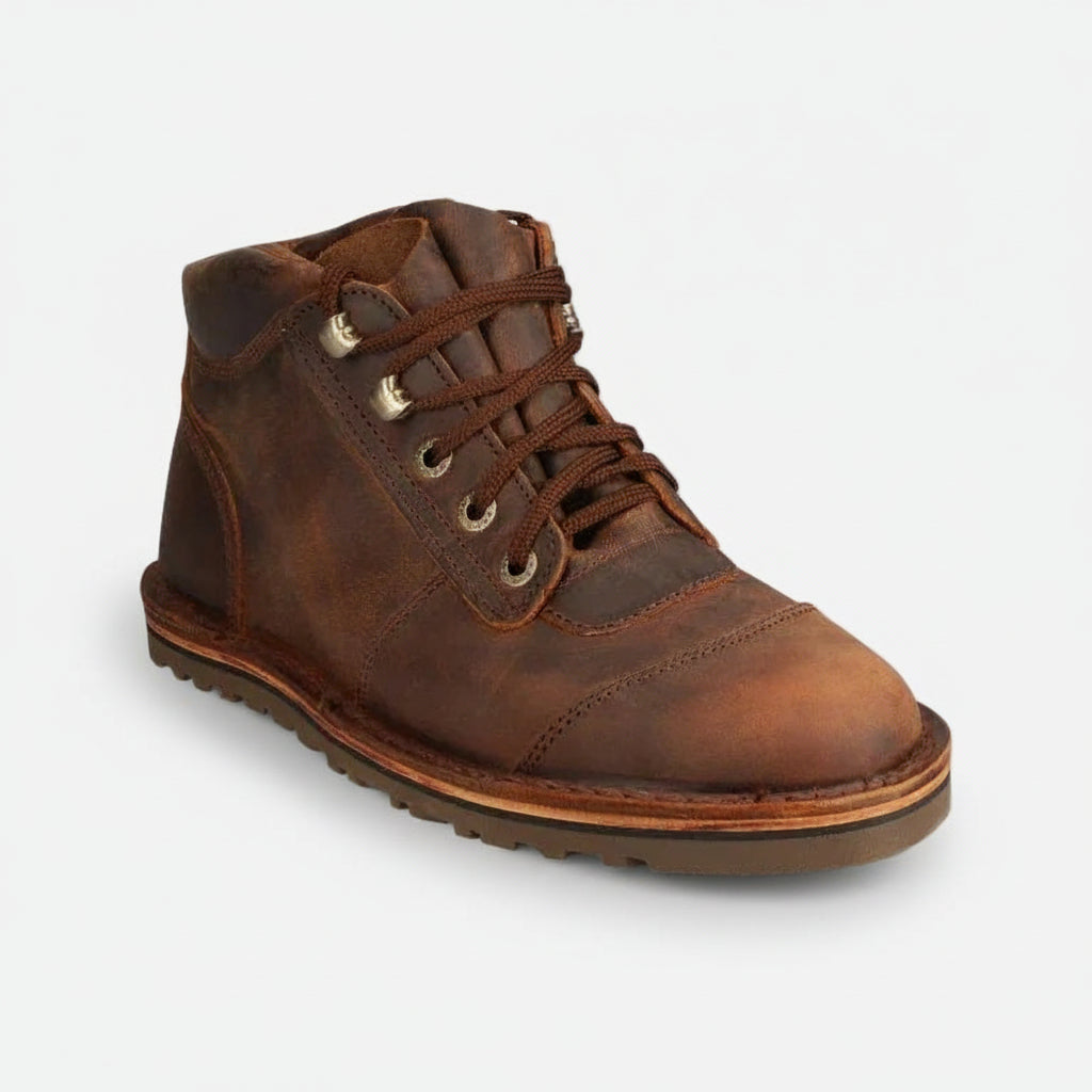 Brown leather boot on a white background