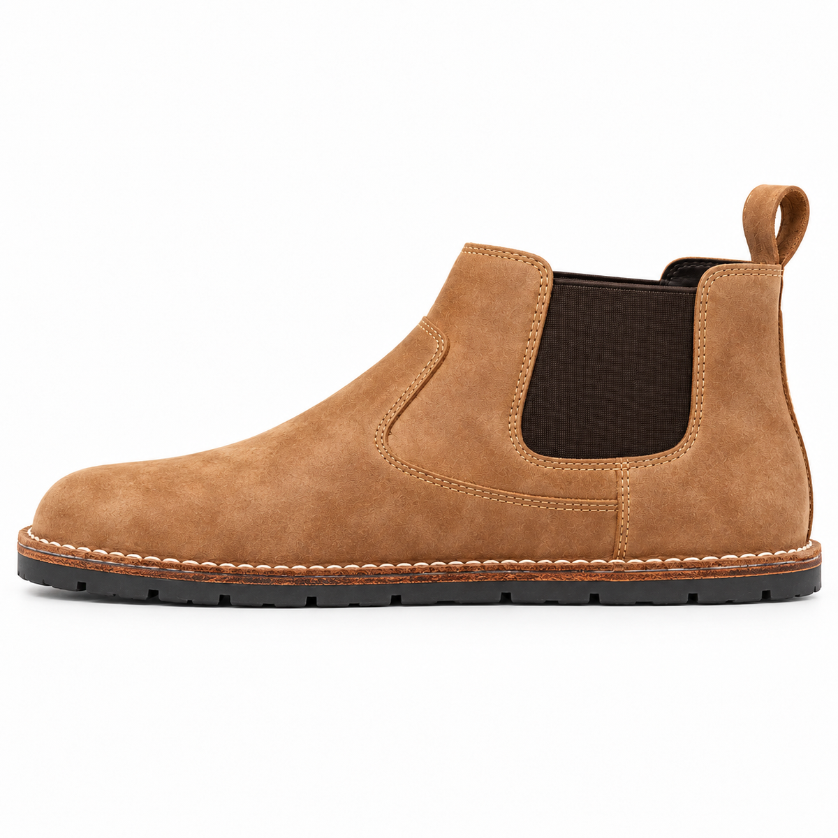 A tan suede Chelsea boot with a dark brown elastic side panel and a black sole, shown in a side profile on a white background.