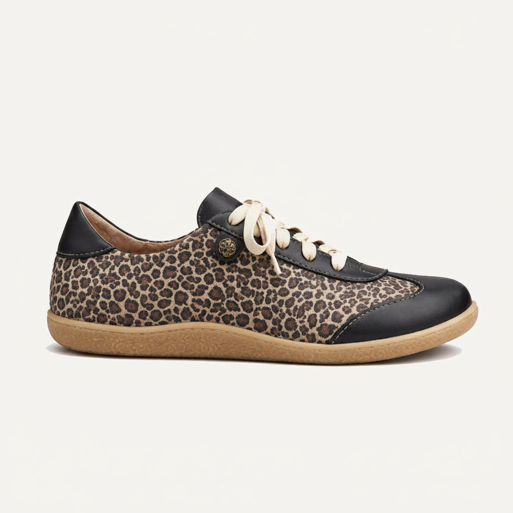 Leopard print sneaker with black and beige accents on a white background