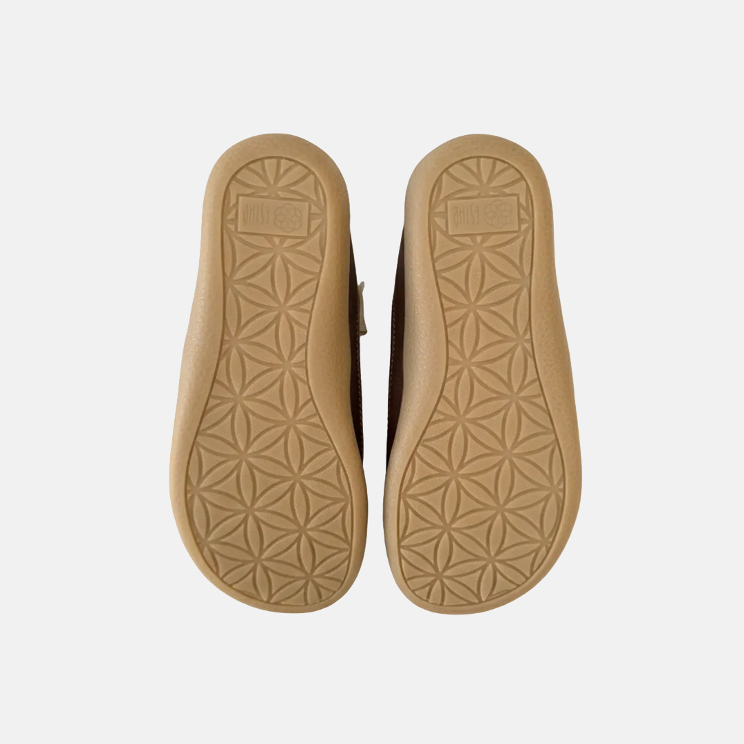Tan insole with geometric pattern on a white background