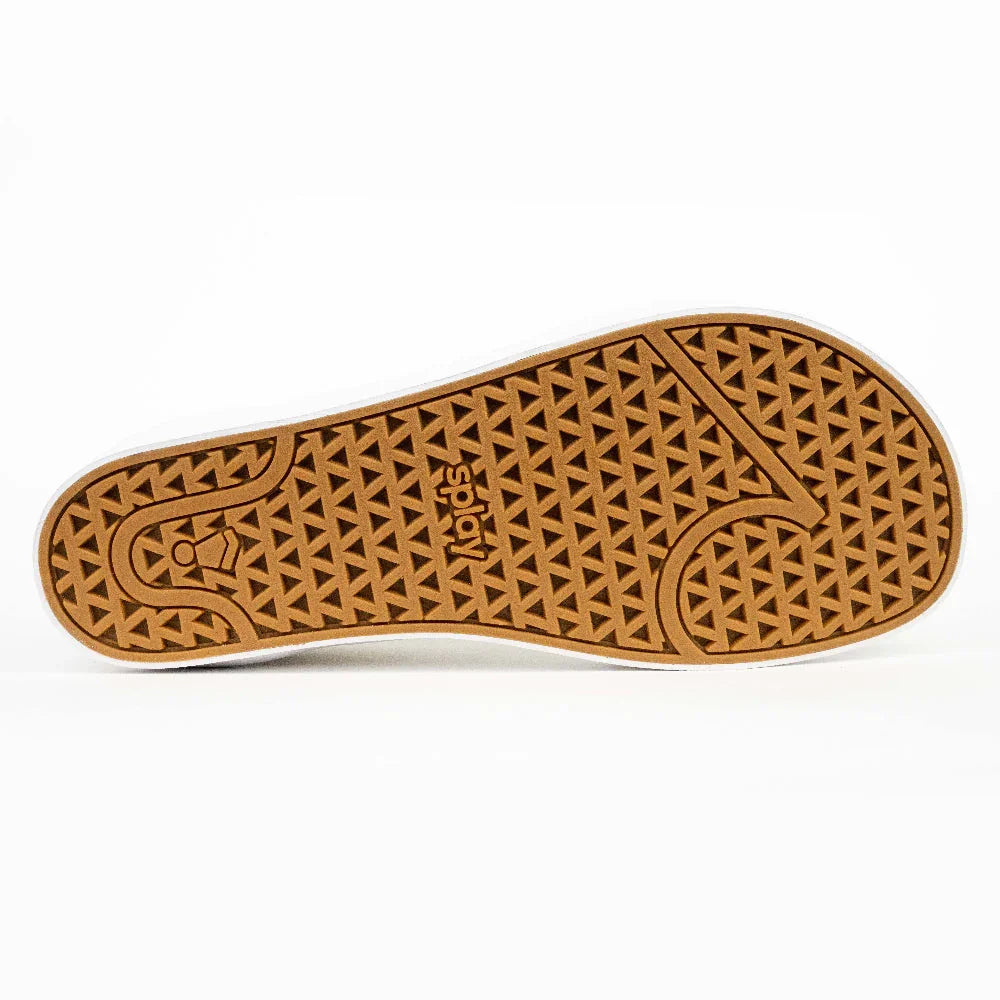Brown rubber sole of a Spida shoe with triangular tread pattern on white background
