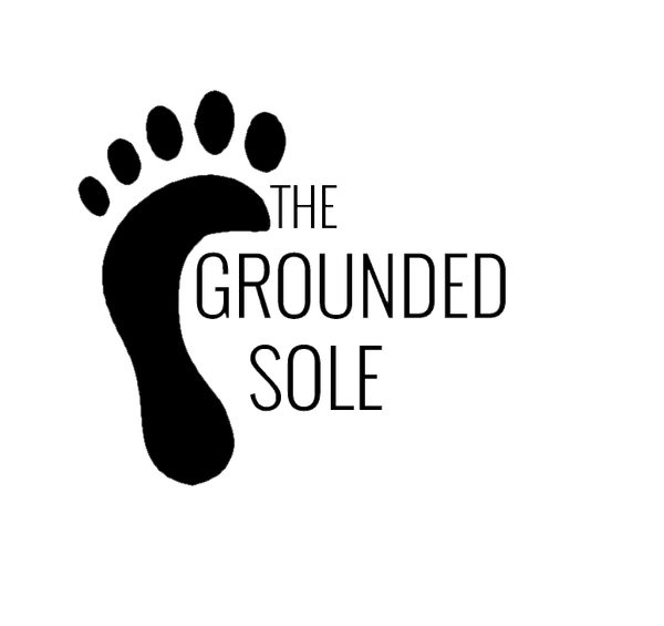 Black footprint icon with 'The Grounded Sole' text on a white background