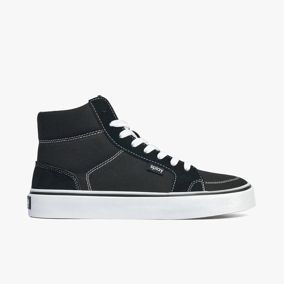 Black high-top sneaker with white laces, white stitching, and thick white sole on white background