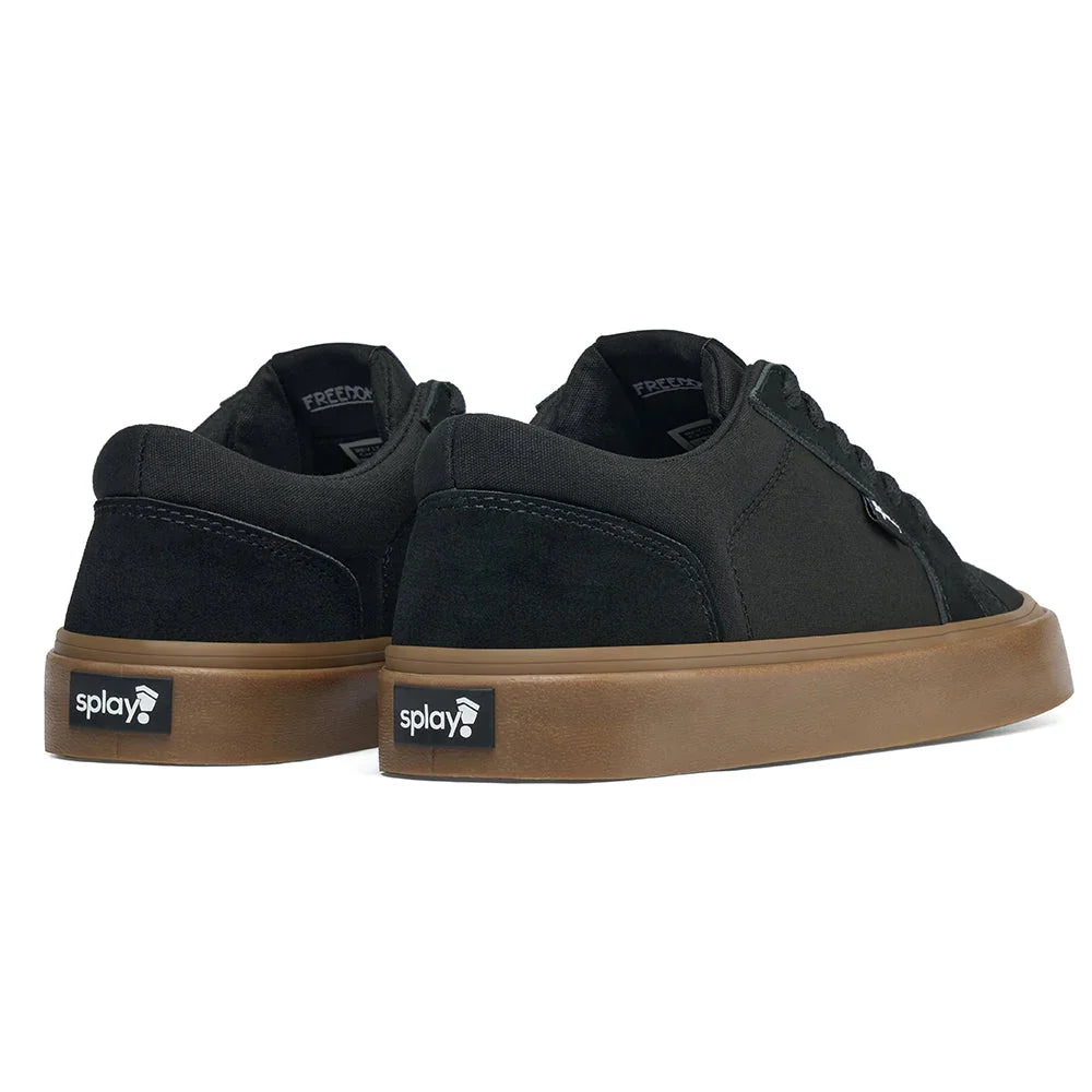 Pair of black canvas and suede sneakers with brown rubber soles and Splay brand logo